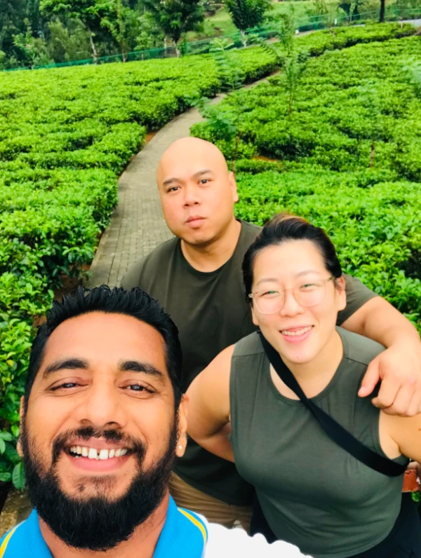 priyan with guests in srilankan tea fields